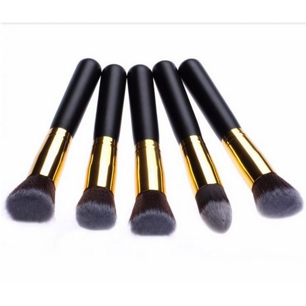 The PRO Makeup Brush Set by PRO features 10 premium kabuki and precision brushes with black handles, gold ferrules, and soft bristles, each with a unique head shape for flawless makeup application.